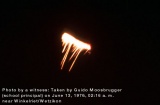 #568.[90] Bar of intense light with a glittering rain of fire falling down. Photographed by Guido Moosbrugger on 13th June 1976.[91]