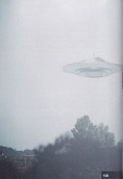 Photo Inventarium 2014 - cat no. #138. 20th May, 1975 at 15:00. Beamship of Semjase over the Wihaldenstrasse in the north in Hinwil, Switzerland. The ship is semi-transparent. The proximity of the vessel and its vibrations may have affected the quality of the film.[15]