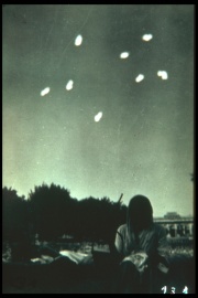 Eight unknown bullet shaped illuminating UFOs over New Dehli, India, 19th May 1964.