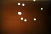 Eight unknown bullet shaped illuminating UFOs over New Dehli Railway Station, India. A very large group of people witnessed this event on 16 June 1964.