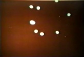 Eight unknown bullet shaped illuminated UFOs over New Dehli Railway Station, India. Very large group of witnesses to event 16th June 1964.