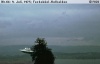 Semjase flying with her beamship around a wettertanne (weather pine) 14m height (the tree later eliminated by Semjase). Pfaffikersee in background. 9 July 1975.