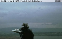 Semjase flying with her beamship around a wettertanne (weather pine) 14m height (the tree later eliminated by Semjase). Pfaffikersee in background. 9th July 1975.