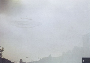 Photo Inventarium 2014 - cat no. #8. 20th May, 1975 at 15:00. Beamship of Semjase over the Wihaldenstrasse in the north in Hinwil, Switzerland. The ship is semi-transparent. The proximity of the vessel and its vibrations may have affected the quality of the film.[181]