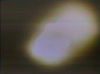 This picture shows the disc-shaped object surrounded by a yellow haze photographed by Guido Moosbrugger on 13 June, 1976 (source of image: the documentary Contact.)